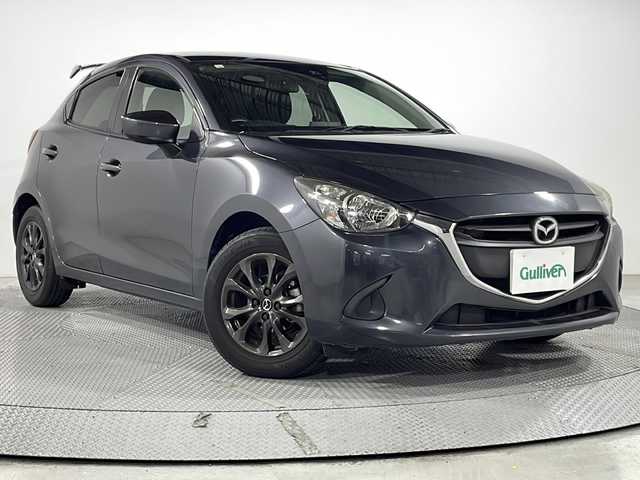 マツダ デミオ 13S 広島県 2016(平28)年 6.8万km メテオグレーマイカ 禁煙/マツダコネクトナビ/・Ｂｌｕｅｔｏｏｔｈ接続/・ＣＤ／ＤＶＤ／ＴＶ再生/バックカメラ/リアウィング/ＥＴＣ　/衝突軽減ブレーキ　/横滑り抑制/純正フロアマット　/カーテンエアバッグ/アイドリングストップ