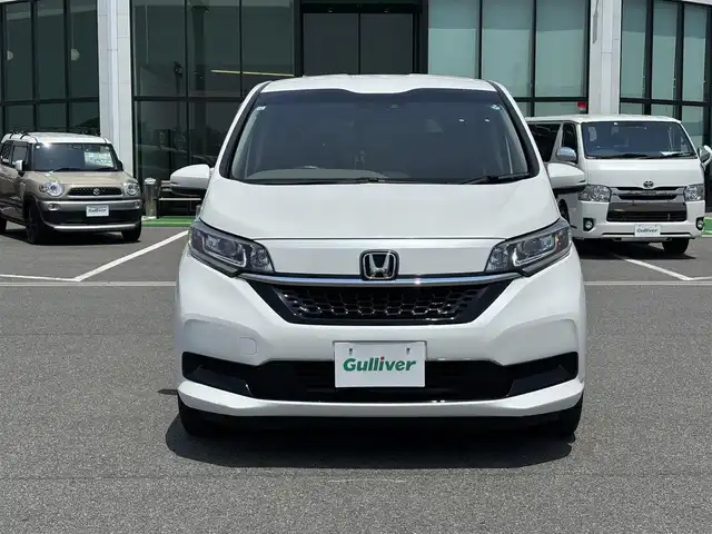 ホンダ フリード ハイブリット G ホンダセンシング 奈良県 2021(令3)年 4.6万km パール ９インチ純正ナビ　/フルセグテレビ　/ｂｌｕｅｔｏｏｔｈ　/ＨＤＭＩ　/バックカメラ　/両側パワースライドドア　/ハーフレザー　/シートヒーター　/フロントガラス熱線スイッチ　　/ビルトインＥＴＣ　/前後社外ドライブレコーダー/2列目テーブル（運転席＋助手席）/USBポート/パーキングセンサーシステム