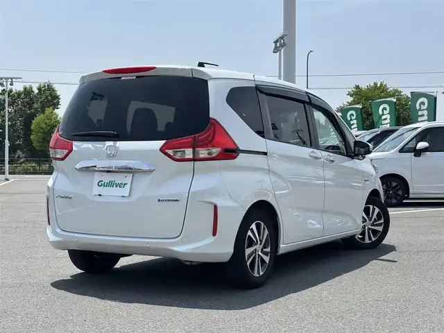 ホンダ フリード ハイブリット G ホンダセンシング 奈良県 2021(令3)年 4.6万km パール ９インチ純正ナビ　/フルセグテレビ　/ｂｌｕｅｔｏｏｔｈ　/ＨＤＭＩ　/バックカメラ　/両側パワースライドドア　/ハーフレザー　/シートヒーター　/フロントガラス熱線スイッチ　　/ビルトインＥＴＣ　/前後社外ドライブレコーダー/2列目テーブル（運転席＋助手席）/USBポート/パーキングセンサーシステム