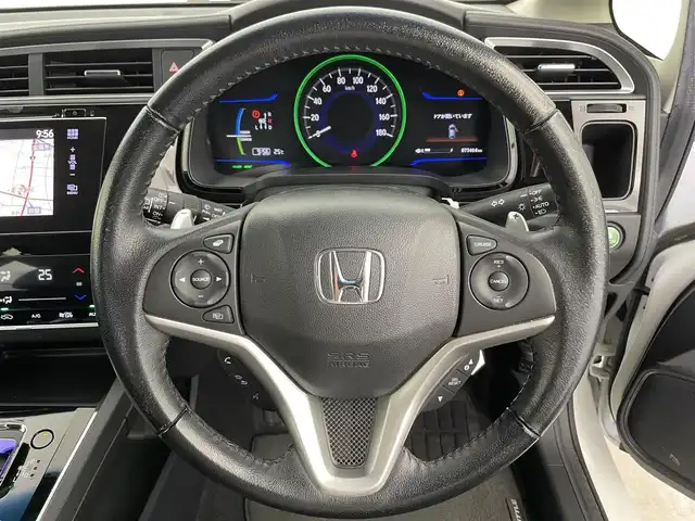 ホンダ シャトル ハイブリッド X 富山県 2015(平27)年 7.4万km ホワイトオーキッドパール 純正ナビ（CD DVD bluetooth）/フルセグTV/HDMI/バックカメラ/ビルトインETC/フロントドラレコ（DRY-AS350GS）/純正15インチAW/15インチスタッドレスセット積込み/パドルシフト/ハーフレザーシート/オートライト/LEDヘッドライト/スマートキー/プッシュスタート/クルーズコントロール/横滑防止装置/純正マット/保証書/スペアキー