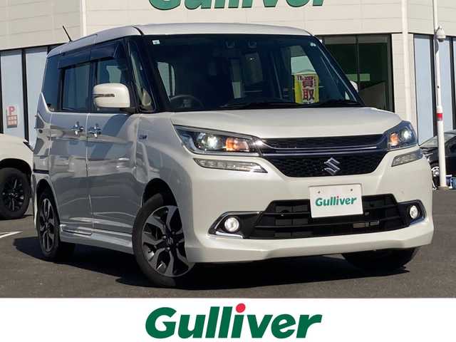 スズキ ソリオ バンディット Fリミテッド 佐賀県 2017(平29)年 4.6万km ピュアホワイトP Carrozzeria8インチナビ/Carrozzeriaフリップダウンモニター/バックカメラ/両側パワースライドドア/デュアルカメラブレーキサポート/路線逸脱警報/クルーズコントロール/ハーフレザーシート/シートヒーター/ETC/ステアリングリモコン/ドライブレコーダー/アイドリングストップ/プッシュスタート/スマートキー/LEDヘッドライト/フォグライト/純正アルミホイール