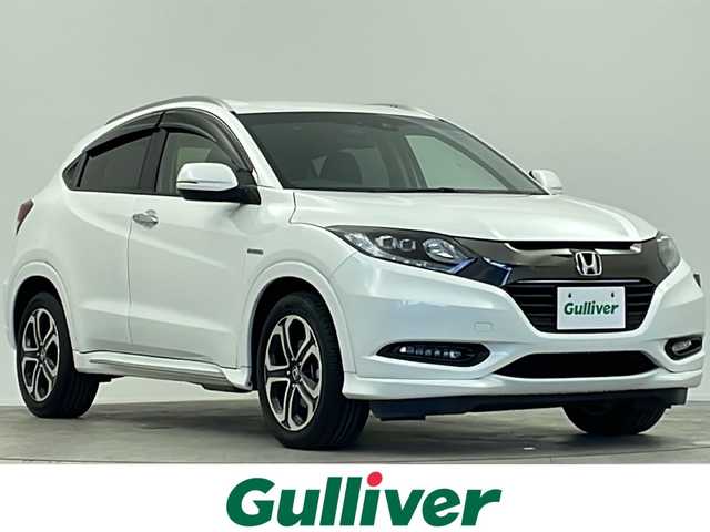 ホンダ ヴェゼル ハイブリッド Z ホンダセンシング 大阪府 2016(平28)年 3.5万km ホワイトオーキッドパール 純正SDナビ/【BT/フルセグTV/HDMI/USB/AUX/ipod/DVD】/バックカメラ/ETC/ドライブレコーダー前後/衝突被害軽減システム/クルーズコントロール追従/レーンキープアシスト/先行車発進アラーム/オートライト/LEDライト/パドルシフト/BRAKEHOLD/ハーフレザーシート/シートヒーター/純正17インチAW/純正フロアマット/スマートキー