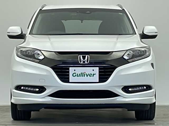 ホンダ ヴェゼル ハイブリッド Z ホンダセンシング 大阪府 2016(平28)年 3.5万km ホワイトオーキッドパール 純正SDナビ/【BT/フルセグTV/HDMI/USB/AUX/ipod/DVD】/バックカメラ/ETC/ドライブレコーダー前後/衝突被害軽減システム/クルーズコントロール追従/レーンキープアシスト/先行車発進アラーム/オートライト/LEDライト/パドルシフト/BRAKEHOLD/ハーフレザーシート/シートヒーター/純正17インチAW/純正フロアマット/スマートキー