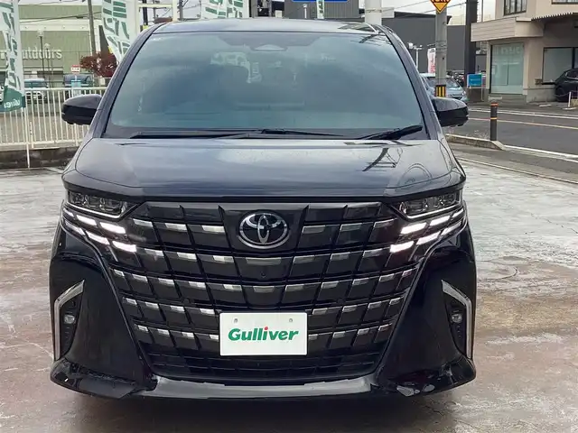 トヨタ アルファード Z 京都府 2025(令7)年 0.2万km ブラック ワンオーナー/トヨタチームメイト/左右独立サンルーフ/ヘッドアップディスプレー/タッチトレーサーオペレーション/１３．２インチフリップダウンモニター/スペアタイヤ/デジタルインナーミラー/前後ドライブレコーダー/パノラミックビューカメラ/ＰＷバックドア/前席、２列目ＰＷシート/前席、２列目シートベンチレーション/置くだけ充電/１４インチディスプレイオーディオプラス/ナビ・フルセグＴＶ・USB・BT・HDMI/ビルトインETC2.0/ステアリングヒーター/スペアスマートキー/新車保証書