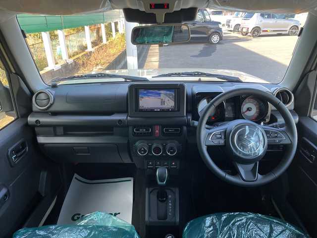 スズキ ジムニー ノマド FC 茨城県 2025(令7)年 0.1千km ベージュ 社外SDナビ/４WD/クリアランスソナー/アイドリングストップ/アダプティブクルーズコントロール/シートヒーター/ダウンヒルアシストコントロール/横滑り防止装置/レーンキープアシスト/オートライト/オートマチックハイビーム/衝突軽減システム/LEDヘッドライト/純正フロアマット/純正15インチアルミホイール/スマートキー