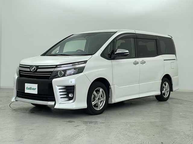 トヨタ ヴォクシー ZS 煌Ⅱ 宮城県 2017(平29)年 5.3万km ホワイトパールクリスタルシャイン 純正12型フリップダウンモニター/Toyota Safety Sense 		/・プリクラッシュセーフティ		/・レーンディパーチャーアラート		/・オートマチックハイビーム		/・先行車発進告知	/純正１０型ナビ/・SD.DVD.CD.BT/フルセグTV/バックカメラ/両側パワースライドドア/ステアリングスイッチ/革巻ステアリング/ビルトインETC2.0/ドライブレコーダー（F）/LEDヘッドライト/LEDフォグランプ/プッシュスタート/スマートキー×２/社外フロアマット/社外15inAW/ワイパーデアイサー/ロールサンシェード/横滑り防止装置/アイドリングストップ/ドアバイザー