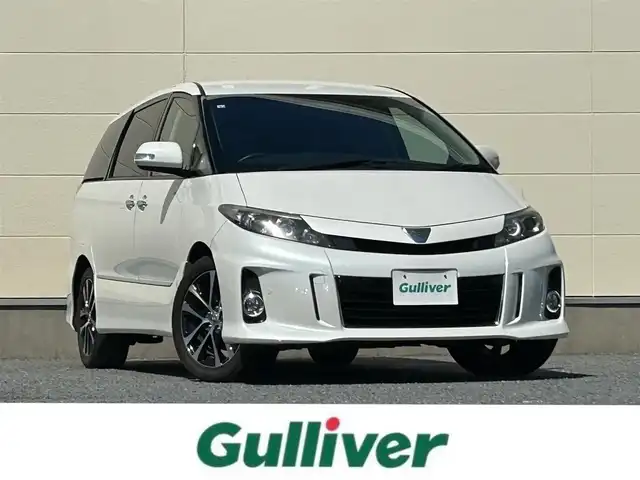 トヨタ エスティマ アエラス レザーパッケージ 茨城県 2015(平27)年 6.9万km ホワイトパールクリスタルシャイン プッシュスタート/MT付きAT/スマートキー/Wエアコン/クルーズコントロール/SDナビ（DVD再生機能あり）/フルセグTV/ビルトインETC/carrozzeriaフリップダウンモニター/格納式サードシート/D席パワーシート/純正フロアマット/両側パワースライドドア/純正アルミホイル/前後クリアランスソナー/オートライト/Wエアバック