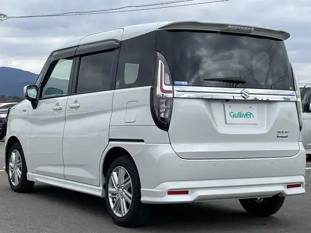 スズキ ソリオ HV MZ 佐賀県 2022(令4)年 4.2万km ピュアホワイトP 純正8インチSDナビゲーション/・フルセグTV/CD/DVD/SD/USB/Bluetooth/全周囲カメラ/前方ドライブレコーダー/ビルトインETC/ヘッドアップディスプレイ/両側パワースライドドア/DN席シートヒーター/天井サーキュレーター/後席サンシェード/ISOFIX対応/革巻きステアリング/ステアリングリモコン/純正15インチアルミホイール/純正LEDヘッドライト/・オートマチックハイビーム/純正LEDフォグランプ/純正フロアマット/純正ドアバイザ―/新車保証書/アダプティブクルーズコントロール/車線逸脱警報機能/デュアルカメラブレーキサポート/クリアランスソナー