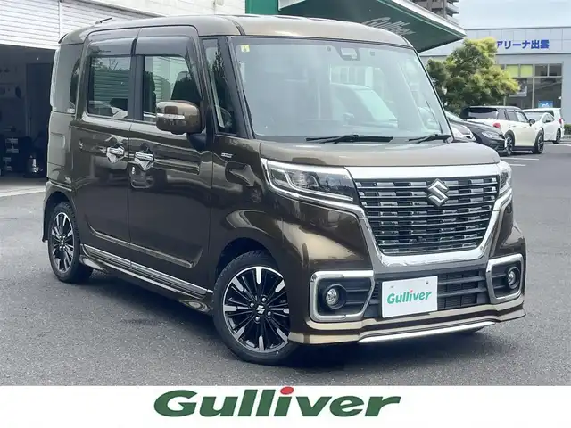 スズキ スペーシア カスタム HYBRID XS ターボ 島根県 2018(平30)年 1.9万km ブレイブカーキP ８インチ純正ＳＤナビ/フルセグTV/DVD再生/Ｂｌｕｅｔｏｏｔｈオーディオ/全方位/バック/サイドカメラ/前方ドライブレコーダー/後方コーナーセンサー/ＥＴＣ/両側パワースライドドア/クルーズコントロール/衝突被害軽減ブレーキ/横滑り防止装置/レーンキープアシスト/リアサーキュレーター/ハーフレザーシート/D席シートヒーター/アイドリングストップ/純正LEDヘッドライト/純正フロアマット/純正15インチアルミホイール