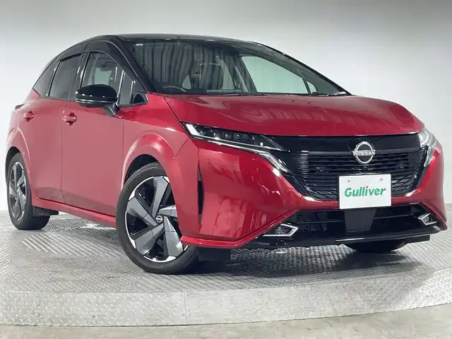 日産 オーラ G レザーエディション 神奈川県 2021(令3)年 1.4万km ガーネットレッド/スーパーブラック 2トーン 9型メーカーオプションナビゲーション/AM FM Bluetooth フルセグ HDMI AppleCarPlay/アラウンドビューモニター/BOSEプレミアムサウンド/ビークルダイナミクスコントロール/ハンドル支援/プロパイロット/車線逸脱警報/車線逸脱防止支援/後側方車両検知警報/後側方衝突防止支援/エマージェンシーブレーキ/速度標識表示/標識検知支援/駐車支援/ふらつき警報/デジタルインナーミラー/レザーシート/前席シートヒーター/ステアリングヒーター/ステアリングリモコン/ビルトインETC2.0/オートホールド/純正フロアマット/インテリジェントキー/スペアキー/LEDヘッドライト/オートライト/オートマチックハイビーム/純正17インチアルミホイル