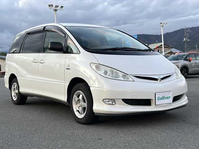 トヨタ エスティマ ハイブリッド Gセレクション 山梨県 2004(平16)年 18.1万km ホワイトパールマイカ 純正ナビ/バックカメラ/両側スライドドア/リモコンキー/クルーズコントロール/ETC/純正15インチAW/オートライト/ライトレベライザー