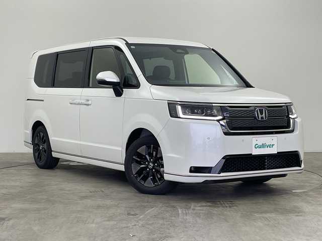 ホンダ ステップワゴン スパーダ eHEV 群馬県 2025(令7)年 0.1千km プラチナホワイトパール 純正１１．４型ナビ　アダプティブクルーズコントロール　ホンダセンシング　衝突被害軽減システム　バックカメラ　電動リアゲート　両側パワースライドドア　プッシュスタート　スマートキー　オートライト　禁煙車