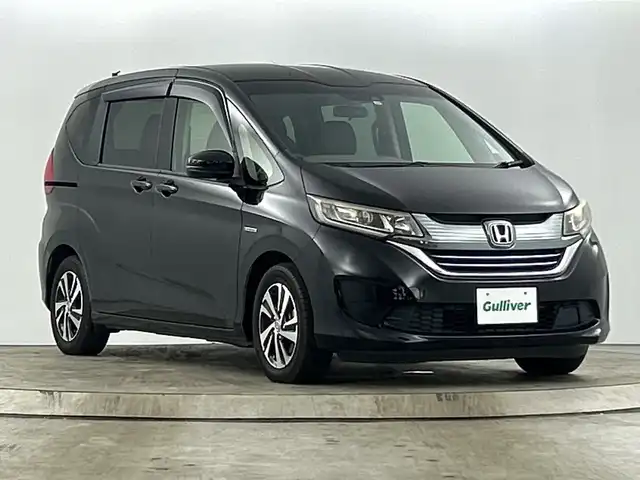 ホンダ フリード ハイブリット EX 愛知県 2017(平29)年 7万km クリスタルブラックパール 純正ナビ７インチインターナビ/（フルセグＴＶ、Bluetooth、DVD再生）　/バックカメラ　/純正前方ドラレコ　/ビルトインＥＴＣ　/ホンダセンシング　/・衝突軽減ブレーキ/・アダプティブクルーズコントロール/・車線維持支援/・誤発進抑制/両側電動スライドドア　/ハーフレザー　（合皮）/シートヒーター　/純正１５インチＡＷ/LEDヘッドライト/プラズマクラスター付きオートエアコン/ロールサンシェード