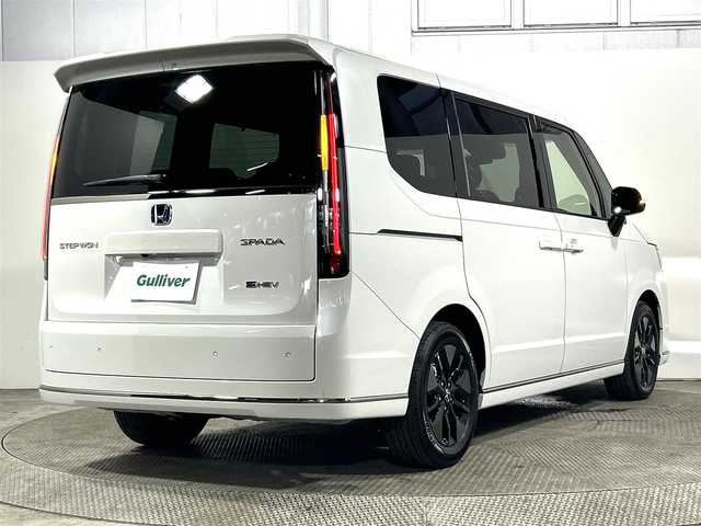 ホンダ ステップワゴン スパーダ eHEV 大阪府 2025(令7)年 0.1万km未満 プラチナホワイトパール 登録済未使用車　純正１１型ナビ（フルセグＴＶ／ＤＶＤ／ＣＤ／Ｂｌｕｅｔｏｏｔｈ）　衝突軽減　バックカメラ　両側電動ドア　ＢＳＭ　ハーフレザー　シートヒーター　電動リアゲート　レーダークルコン　ＵＳＢ