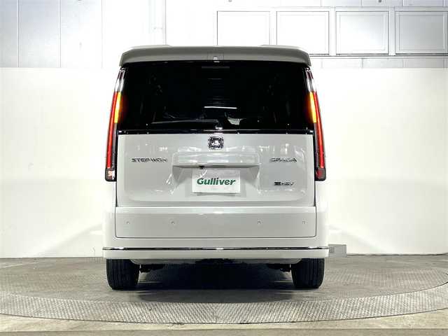 ホンダ ステップワゴン スパーダ eHEV 大阪府 2025(令7)年 0.1万km未満 プラチナホワイトパール 登録済未使用車　純正１１型ナビ（フルセグＴＶ／ＤＶＤ／ＣＤ／Ｂｌｕｅｔｏｏｔｈ）　衝突軽減　バックカメラ　両側電動ドア　ＢＳＭ　ハーフレザー　シートヒーター　電動リアゲート　レーダークルコン　ＵＳＢ