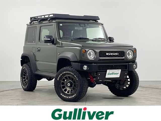 スズキ ジムニー シエラ JC 愛知県 2020(令2)年 3.8万km ジャングルグリーン ワンオーナー/純正8インチナビ/【Bluetooth/フルセグTV/CD/DVD】/バックカメラ/衝突被害軽減ブレーキ/ダウンヒルアシストコントロール/レーンアシスト/クルーズコントロール/横滑り防止装置/イモビライザー/ハイブリッヂファースト製マフラー/社外グリル/リアラダー/リフトアップ/ルーフラック/シートヒーター（D/N）/前後ドライブレコーダー/ETC/オートエアコン/ステアリングスイッチ/LEDオートライト/電動格納ミラー/社外16インチアルミホイール