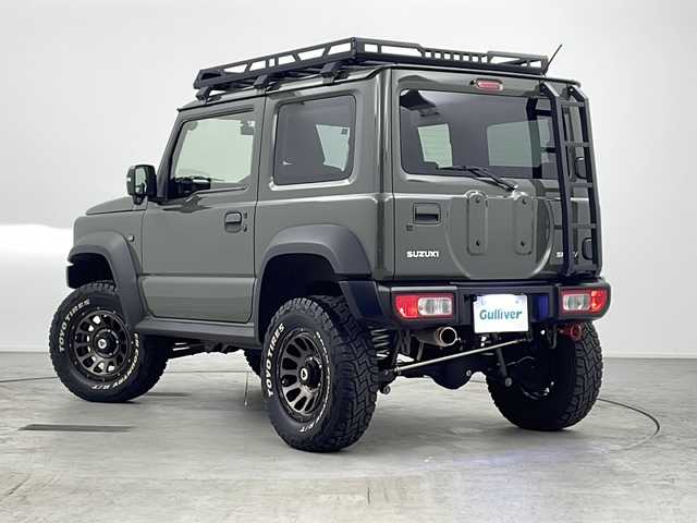 スズキ ジムニー シエラ JC 愛知県 2020(令2)年 3.8万km ジャングルグリーン ワンオーナー/純正8インチナビ/【Bluetooth/フルセグTV/CD/DVD】/バックカメラ/衝突被害軽減ブレーキ/ダウンヒルアシストコントロール/レーンアシスト/クルーズコントロール/横滑り防止装置/イモビライザー/ハイブリッヂファースト製マフラー/社外グリル/リアラダー/リフトアップ/ルーフラック/シートヒーター（D/N）/前後ドライブレコーダー/ETC/オートエアコン/ステアリングスイッチ/LEDオートライト/電動格納ミラー/社外16インチアルミホイール