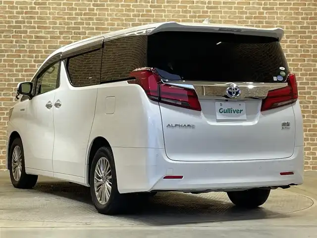 トヨタ アルファードハイブリット 岩手県 2019(令1)年 4.6万km ホワイトパールクリスタルシャイン ４WD/MTモード付AT/両側パワースライドドア/パワーバックドア/100V電源/パワーシート/プリクラッシュセーフティ/レーンアシスト/コーナーセンサー/パーキングサポートブレーキ/ロードサインアシスト/先行車発進告知機能/クルーズコントロール/アイドリングストップ/横滑り防止装置/オートライト/オートハイビーム/オットマン/オールオートパワーウィンドウ/純正ナビ/純正フロアマット/ドライブレコーダー/ETC2.0