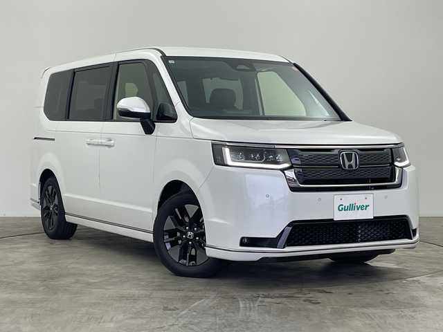 ホンダ ステップワゴン スパーダ eHEV 群馬県 2025(令7)年 0.1千km プラチナホワイトパール 純正１１．４型ナビ　アダプティブクルーズコントロール　ホンダセンシング　衝突被害軽減システム　バックカメラ　電動リアゲート　両側パワースライドドア　プッシュスタート　スマートキー　オートライト　禁煙車