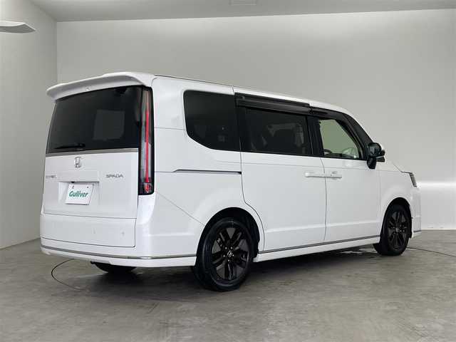 ホンダ ステップワゴン スパーダ 埼玉県 2023(令5)年 1.7万km プラチナホワイトパール 純正９インチナビ　フリップダウンモニター　バックカメラ　アダクティブクルーズコントロール　ＢＳＭ　シートヒーター　ＨＤＭＩ　前後ドラレコ　ビルトインＥＴＣ２．０　両側パワースライドドア　　地デジＴＶ