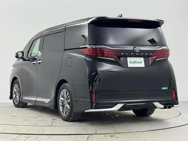 トヨタ アルファード Z 熊本県 2024(令6)年 1.1万km ブラック 禁煙車/トヨタセーフティセンス/純正12.3型ディスプレイオーディオ/（T-CONNECT/Bluetooth/フルセグTV/ナビ）/純正13.2型有機EL後席ディスプレイ/純正モデリスタエアロ/純正ビルトイン2.0ETC/純正18インチアルミ/純正LEDオートライト/純正LEDフォグ/純正フロアマット/両側電動スライドドア/黒レザーシート/左右独立ムーンルーフ/パノラミックビューモニター/アダプティブクルーズコントロール/レーンディパーチャーアラート/オートマチックハイビーム/ブラインドスポットモニター/ドライバーモニター/クリアランスソナー/デジタルインナーミラー/エグゼクティブパワーシート/ウッドコンビ本革巻ハンドル/前席パワーシート/エアシート/スマートキー/プッシュエンジンスタート/スペアキー/新車時保証書/取扱い説明書