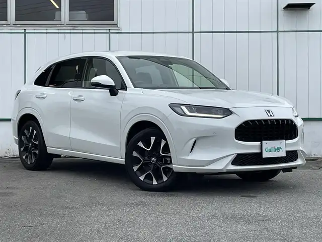 ホンダ ＺＲ－Ｖ ハイブリッド e:HEV Z 山梨県 2022(令4)年 4.2万km プラチナホワイトパール 純正9型ナビ/フルセグTV/ハンズフリーパワーバックドア/全方位モニター/ビルトインETC2.0/レーダークルーズコントロール/コーナーセンサー/ホンダセンシング/・衝突軽減ブレーキ/・前後誤発進抑制機能/・車線維持支援システム/・先行車発進お知らせ機能/・ブラインドスポットモニター/・後退出庫サポート/LEDヘッドランプ/革巻きステアリング/ステアリングヒーター/本革シート/前席パワーシート/シートヒーター/BOSEプレミアムサウンドシステム/純正18インチアルミホイール/スマートキーシステム/禁煙車