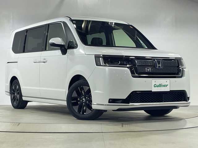 ホンダ ステップワゴン スパーダ eHEV 神奈川県 2025(令7)年 0.1千km プラチナホワイトパール 登録済未使用車/e:HEV/ホンダセンシング/11.4インチナビ/Honda CONNECT/ワンオーナー/前席シートヒーター/LEDヘッドライト/スマートキー/スペアキー/メモリナビ/フルセグテレビ/バックカメラ/アイドリングストップ/オットマン/プッシュスタート/ステアリングスイッチ/電動パーキングブレーキ/ブレーキオートホールド/両側パワースライドドア/パワーバックドア/オートライト/オートマチックハイビーム/フォグランプ/電動格納ミラー/取扱説明書/保証書/衝突軽減ブレーキ/後方誤発進抑制機能/歩行者事故低減ステアリング/渋滞追従機能付アダプティブクルーズコントロール/車線維持支援システム/先行者発信お知らせ機能/急アクセル抑制スイッチ/誤発進抑制機能/近距離衝突軽減ブレーキ/路外逸脱抑制機能/トラフィックジャムアシスト/標識認識機能/ブラインドスポットインフォメーション