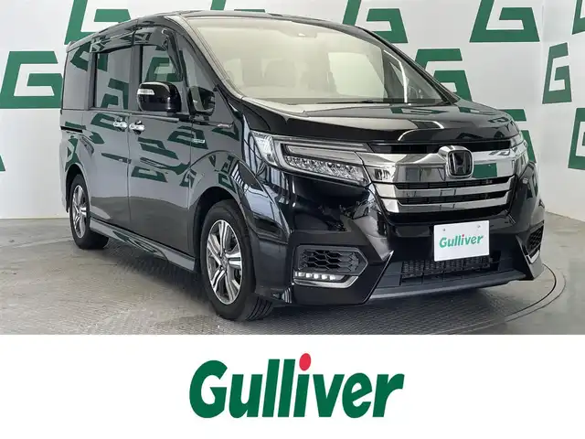 ホンダ ステップワゴン スパーダ ハイブリッド G EX ホンダセンシング 鹿児島県 2018(平30)年 4万km プレミアムスパークルブラックパール 禁煙車/純正ナビ(CD/DVD/Bluetooth/フルセグTV)　/ホンダセンシング　/○衝突軽減ブレーキ〈CMBS〉/○路外逸脱抑制機能/○ACC〈アダプティブ・クルーズ・コントロール〉/バックカメラ　/両側パワースライドドア　/前席シートヒーター　/ＬＥＤヘッドライト　/オートライト　/前方ドライブレコーダー　/ＥＴＣ　/純正アルミホイール　/ドアバイザー