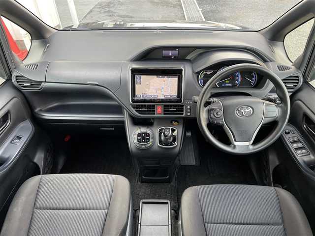 トヨタ ヴォクシー ハイブリッド X 東京都 2015(平27)年 10.6万km ダークバイオレットマイカメタリック 純正ナビ　/ＣＤ　/Ｂｌｕｅｔｏｏｔｈ　/ＤＶＤ　/バックカメラ　/両側電動スライドドア　/フリップダウンモニター　/前後ドライブレコーダー　/ＥＴＣ　/テレビキャンセラー　/純正アルミホイール　/衝突被害軽減ブレーキ/ABS/横滑り防止装置/オートライト