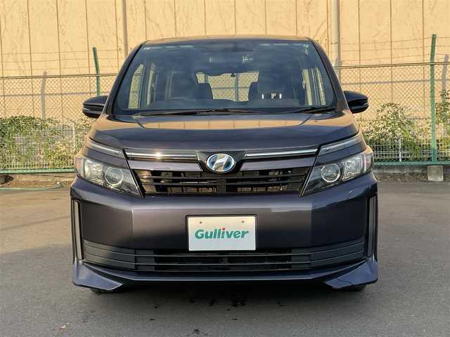 トヨタ ヴォクシー ハイブリッド X 東京都 2015(平27)年 10.6万km ダークバイオレットマイカメタリック 純正ナビ　/ＣＤ　/Ｂｌｕｅｔｏｏｔｈ　/ＤＶＤ　/バックカメラ　/両側電動スライドドア　/フリップダウンモニター　/前後ドライブレコーダー　/ＥＴＣ　/テレビキャンセラー　/純正アルミホイール　/衝突被害軽減ブレーキ/ABS/横滑り防止装置/オートライト