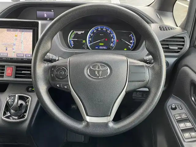 トヨタ ヴォクシー ハイブリッド X 東京都 2015(平27)年 10.6万km ダークバイオレットマイカメタリック 純正ナビ　/ＣＤ　/Ｂｌｕｅｔｏｏｔｈ　/ＤＶＤ　/バックカメラ　/両側電動スライドドア　/フリップダウンモニター　/前後ドライブレコーダー　/ＥＴＣ　/テレビキャンセラー　/純正アルミホイール　/衝突被害軽減ブレーキ/ABS/横滑り防止装置/オートライト