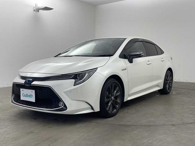 トヨタ カローラ ハイブリット ダブルバイビー 兵庫県 2020(令2)年 5.2万km ホワイトパールクリスタルシャイン ・純正ディスプレイオーディオ/・Bluetooth/USB/AM/FM/TV//Apple carplay/Android Auto/・バックカメラ/・ビルトインETC/・Toyota　Safety　Sense/・プリクラッシュセーフティ/・レーントレーシングアシスト/・レーダークルーズコントロール全車速追従機能付/・オートマチックハイビーム/・ロードサインアシスト/・インテリジェントクリアランスソナー/・パーキングサポートブレーキ/・ブラインドスポットモニター/・リヤクロストラフィックアラート/・先行車発進告知/・革巻きステアリング/・純正１７インチアルミホイール/・ＬＥＤヘッドライト/・オートライト/・フォグランプ/・ハーフレザー/・社外フロアマット/・スマートキー/・プッシュスタート