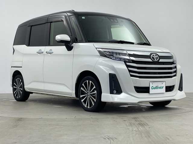 トヨタ ルーミー カスタムG－T 鹿児島県 2021(令3)年 0.8万km ブラックマイカメタリック/パールホワイト2トーン 純正9インチナビ/（CD/DVD/BT/フルセグTV）/純正フリップダウンモニター/両側パワースライドドア/レーダークルーズコントロール/スマートアシスト/パノラミックビューモニター/シートヒーター/ドライブレコーダー/電動パーキングブレーキ/オートホールド機能/オートライト/オートマチックハイビーム/コーナーセンサ―/アイドリングストップ