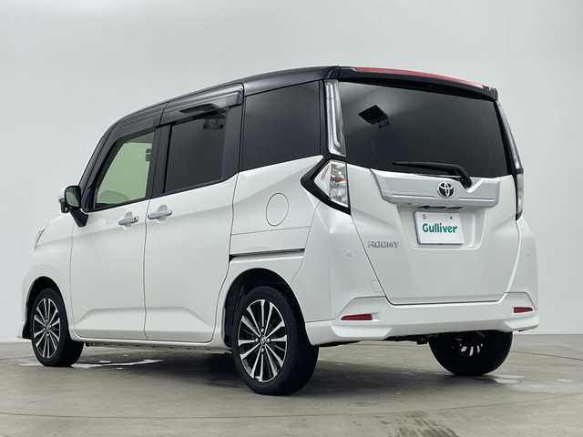 トヨタ ルーミー カスタムG－T 鹿児島県 2021(令3)年 0.8万km ブラックマイカメタリック/パールホワイト2トーン 純正9インチナビ/（CD/DVD/BT/フルセグTV）/純正フリップダウンモニター/両側パワースライドドア/レーダークルーズコントロール/スマートアシスト/パノラミックビューモニター/シートヒーター/ドライブレコーダー/電動パーキングブレーキ/オートホールド機能/オートライト/オートマチックハイビーム/コーナーセンサ―/アイドリングストップ