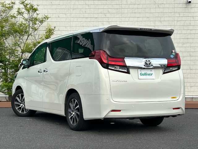 トヨタ アルファード G 茨城県 2015(平27)年 5.9万km ラグジュアリーホワイトパールクリスタルシャインガラスフレーク 社外ナビ /（BT/AM/FM/フルセグTV）/４ＷＤ　/クルーズコントロール追尾あり/ＥＴＣ　/両側パワースライドドア　/メモリー付きパワーシート　/コーナーセンサー前後　/ＬＥＤライト　/オットマン　/アイドリングストップ　/スマートキー/純正ＡＷ　