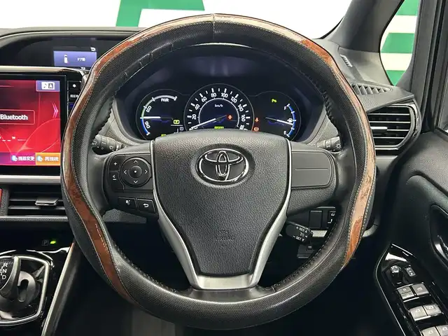 トヨタ ヴォクシー ハイブリッド ZS 煌Ⅱ 鹿児島県 2019(平31)年 7.6万km ブラック ワンオーナー/禁煙車/ナビ/(フルセグTV/Bluetooth/DVD/CD)/フリップダウンモニター/バックカメラ/クルーズコントロール/前席シートヒーター/Toyota Safety Sense/　・プリクラッシュセーフティ/　・レーンディパーチャーアラート/　・オートマチックハイビーム/両側パワースライドドア/ドライブレコーダー/ETC/純正アルミホイール/フロアマット/LEDヘッドライト/オートライト/アイドリングストップ/スマートキー