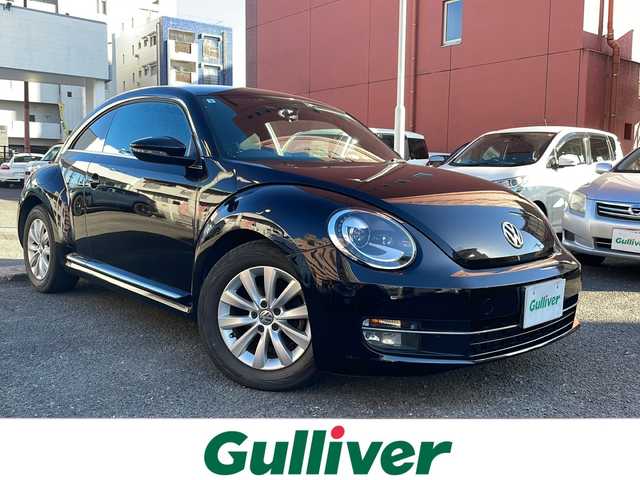 フォルクスワーゲン ザ・ビートル デザイン 宮崎県 2013(平25)年 8.6万km ディープブラックパールエフェクト ・クルーズコントロール　/・Bluetooth/・スペアキー/・スマートキー/・ETC/・電動格納ミラー/・純正SDナビ/・フルセグTV/・MTモード付AT/・純正HDDナビ/・純正フロアマット/・純正アルミホイール/・横滑り防止装置/・ミュージックプレイヤー　AUX/・シガーソケット