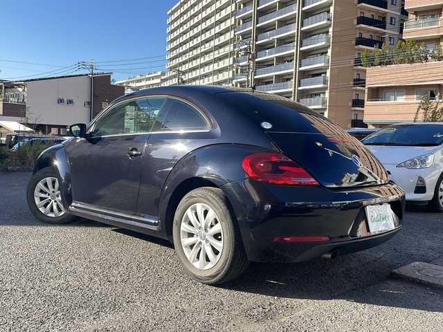 フォルクスワーゲン ザ・ビートル デザイン 宮崎県 2013(平25)年 8.6万km ディープブラックパールエフェクト ・クルーズコントロール　/・Bluetooth/・スペアキー/・スマートキー/・ETC/・電動格納ミラー/・純正SDナビ/・フルセグTV/・MTモード付AT/・純正HDDナビ/・純正フロアマット/・純正アルミホイール/・横滑り防止装置/・ミュージックプレイヤー　AUX/・シガーソケット