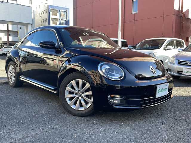 フォルクスワーゲン ザ・ビートル デザイン 宮崎県 2013(平25)年 8.6万km ディープブラックパールエフェクト ・クルーズコントロール　/・Bluetooth/・スペアキー/・スマートキー/・ETC/・電動格納ミラー/・純正SDナビ/・フルセグTV/・MTモード付AT/・純正HDDナビ/・純正フロアマット/・純正アルミホイール/・横滑り防止装置/・ミュージックプレイヤー　AUX/・シガーソケット