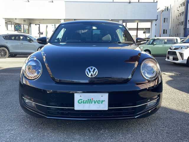 フォルクスワーゲン ザ・ビートル デザイン 宮崎県 2013(平25)年 8.6万km ディープブラックパールエフェクト ・クルーズコントロール　/・Bluetooth/・スペアキー/・スマートキー/・ETC/・電動格納ミラー/・純正SDナビ/・フルセグTV/・MTモード付AT/・純正HDDナビ/・純正フロアマット/・純正アルミホイール/・横滑り防止装置/・ミュージックプレイヤー　AUX/・シガーソケット