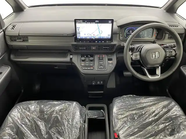 ホンダ ステップワゴン スパーダ eHEV 熊本県 2025(令7)年 0.1千km クリスタルブラックパール 登録済未使用車/純正１１．４インチナビLXM-247VFLi（ＡｐｐｌＣａｒＰｌａｙ・ＡｎｄｒｏｉｄＡｕｔｏ・ＢＴ・フルセグ・ＵＳＢ）/純正15.6インチフリップダウンモニターVM-231FE　/バックカメラ/ホンダセンシング/アダブティブクルーズコントロール/衝突軽減ブレーキ/レーンキープアシスト/ブラインドスポットモニター/アイドリングストップ/横滑り防止/パーキングアシスト/両側パワースライドドア　/前席シートヒーター /パワーバックドア/前後クリアランスソナー/ブレーキホールド/ハーフレザーシート/純正16インチAW/オートライト/オートマチックハイビーム/LEDヘッドライト/フォグライト/スマートキー/プッシュスタート/スペアキー1本/保証書/取扱説明書