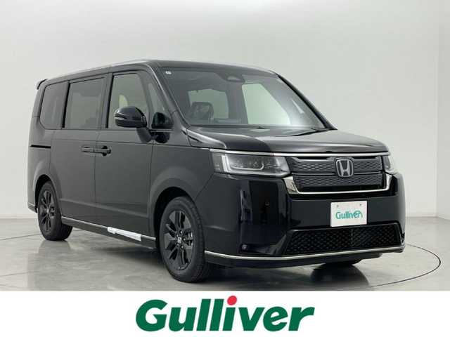 ホンダ ステップワゴン スパーダ eHEV 熊本県 2025(令7)年 0.1千km クリスタルブラックパール 登録済未使用車/純正１１．４インチナビLXM-247VFLi（ＡｐｐｌＣａｒＰｌａｙ・ＡｎｄｒｏｉｄＡｕｔｏ・ＢＴ・フルセグ・ＵＳＢ）/純正15.6インチフリップダウンモニターVM-231FE　/バックカメラ/ホンダセンシング/アダブティブクルーズコントロール/衝突軽減ブレーキ/レーンキープアシスト/ブラインドスポットモニター/アイドリングストップ/横滑り防止/パーキングアシスト/両側パワースライドドア　/前席シートヒーター /パワーバックドア/前後クリアランスソナー/ブレーキホールド/ハーフレザーシート/純正16インチAW/オートライト/オートマチックハイビーム/LEDヘッドライト/フォグライト/スマートキー/プッシュスタート/スペアキー1本/保証書/取扱説明書