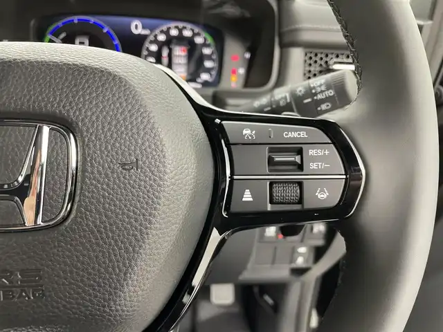 ホンダ ステップワゴン スパーダ eHEV 熊本県 2025(令7)年 0.1千km クリスタルブラックパール 登録済未使用車/純正１１．４インチナビLXM-247VFLi（ＡｐｐｌＣａｒＰｌａｙ・ＡｎｄｒｏｉｄＡｕｔｏ・ＢＴ・フルセグ・ＵＳＢ）/純正15.6インチフリップダウンモニターVM-231FE　/バックカメラ/ホンダセンシング/アダブティブクルーズコントロール/衝突軽減ブレーキ/レーンキープアシスト/ブラインドスポットモニター/アイドリングストップ/横滑り防止/パーキングアシスト/両側パワースライドドア　/前席シートヒーター /パワーバックドア/前後クリアランスソナー/ブレーキホールド/ハーフレザーシート/純正16インチAW/オートライト/オートマチックハイビーム/LEDヘッドライト/フォグライト/スマートキー/プッシュスタート/スペアキー1本/保証書/取扱説明書