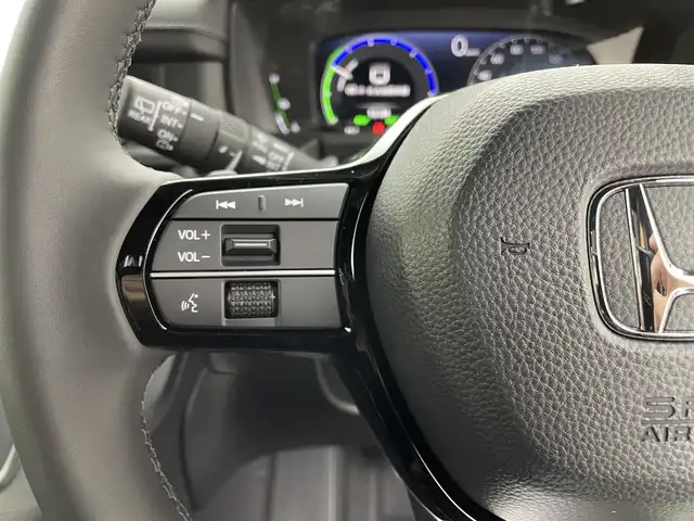 ホンダ ステップワゴン スパーダ eHEV 熊本県 2025(令7)年 0.1千km クリスタルブラックパール 登録済未使用車/純正１１．４インチナビLXM-247VFLi（ＡｐｐｌＣａｒＰｌａｙ・ＡｎｄｒｏｉｄＡｕｔｏ・ＢＴ・フルセグ・ＵＳＢ）/純正15.6インチフリップダウンモニターVM-231FE　/バックカメラ/ホンダセンシング/アダブティブクルーズコントロール/衝突軽減ブレーキ/レーンキープアシスト/ブラインドスポットモニター/アイドリングストップ/横滑り防止/パーキングアシスト/両側パワースライドドア　/前席シートヒーター /パワーバックドア/前後クリアランスソナー/ブレーキホールド/ハーフレザーシート/純正16インチAW/オートライト/オートマチックハイビーム/LEDヘッドライト/フォグライト/スマートキー/プッシュスタート/スペアキー1本/保証書/取扱説明書