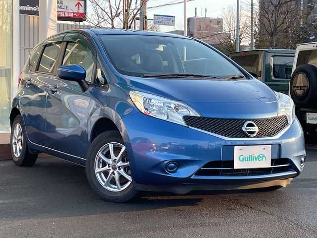 日産 ノート X FOUR 道央・札幌 2015(平27)年 7.6万km シャイニングブルー ・４WD/・衝突軽減ブレーキ/・純正ナビ/　CD＆USB＆TV/・バックカメラ/・レーンキープアシスト/・プッシュスタート/・スマートキー/・電動格納ミラー/・社外AW＆冬タイヤ積込/・純正フロアマット/・ドアバイザー/・ウィンカーミラー/・スペアキー