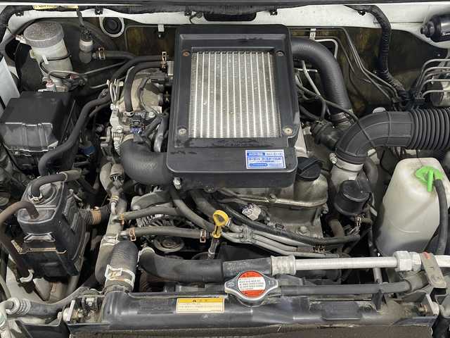 スズキ ジムニー クロスアドベンチャー 新潟県 2012(平24)年 7.7万km パールホワイト 4WD/社外ディスプレイオーディオ/(Bluetooth)/レザーシート/運転席シートヒーター/純正フロアマット/ドアバイザー/ヘッドライトレベライザー/電動格納ミラー/ETC2.0