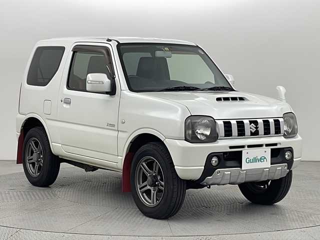 スズキ ジムニー クロスアドベンチャー 新潟県 2012(平24)年 7.7万km パールホワイト 4WD/社外ディスプレイオーディオ/(Bluetooth)/レザーシート/運転席シートヒーター/純正フロアマット/ドアバイザー/ヘッドライトレベライザー/電動格納ミラー/ETC2.0