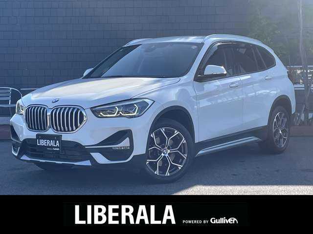 ＢＭＷ Ｘ１ xDrive 18d xライン 滋賀県 2021(令3)年 2.6万km ミネラルホワイト インテリジェントセーフティ　/ＡＣＣ　/ＬＫＡ　/ハーフレザー　/・前席パワーシート　/アンビエントライト　/純正ナビ（ＵＳＢ／ＢＴ）/バックカメラ　/電動リアゲート　/コンフォートアクセス　/コーナーセンサー　/ミラー一体型ＥＴＣ/純正18インチAW