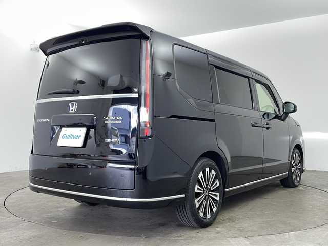 ホンダ ステップワゴン スパーダ eHEV プレミアムライン 兵庫県 2022(令4)年 4.5万km クリスタルブラックパール ・ワンオーナー車/・純正11.4インチナビ（フルセグ・DVD・BT・USB・Aplle Car Play）/・全方位カメラ/・ホンダセンシング/・ステアリングリモコン/・パドルシフト/・パワーバックドア/・両側パワースライドドア/・ハーフレザーシート/・前席シートヒーター/・2列目オットマン/・ホンダセンシング/・衝突軽減ブレーキ（CMBS）/・先行車発進お知らせ機能/・歩行者事故低減ステアリング/・路外逸脱抑制機能/・標識認識機能/・渋滞追従機能付アダプティブクルーズコントロール（ACC）/・車線維持支援システム（LKAS）/・トラフィックジャムアシスト（渋滞運転支援機能）/・ブラインドスポットインフォメーション/・誤発進抑制機能/・後方誤発進抑制機能/・近距離衝突軽減ブレーキ/・急アクセル抑制機能/・パーキングセンサーシステム/・ビルトインETC/・純正前後ドライブレコーダー/・LEDヘッドライト/・フォグランプ/・オートハイビーム/・純正17インチアルミホイール/・純正フロアマット/・スマートキー/・スペアキー/・プッシュスタート/・電動格納ミラー/・W＋サイドエアバック/・カーテンエアバック