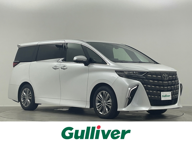 トヨタ アルファードハイブリット Z 埼玉県 2024(令6)年 0.7万km プラチナホワイトパールマイカ 衝突被害軽減ブレーキ/純正14インチディスプレイオーディオナビ（あり）/フリップダウンモニター/三眼LEDヘッドライト/全方位カメラ/両側パワースライドドア/ガラスルーフ/レーダークルーズコントロール/シートヒーター/エアシート/フルセグTV/Bluetooth/バックカメラ/電動リアゲート/パワーシート/ヘッドアップディスプレイ/コーナーセンサー/純正アルミホイール/ETC2.0/ブラインドスポットモニター/パドルシフト/ステアリングヒーター/リアオートエアコン/オートマチックハイビーム/置くだけ充電器/ドライブレコーダー/ステアリングスイッチ/スマートキー/プッシュスタート
